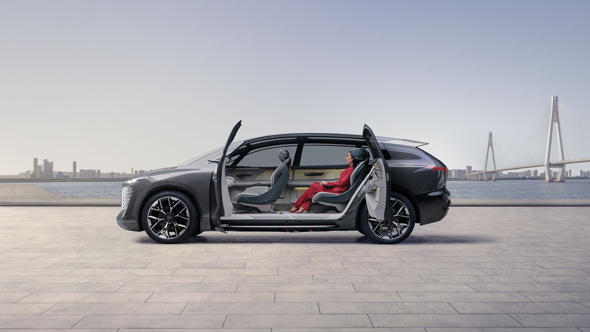 Side view of the Audi urbansphere concept with open swing doors and view of the interior.