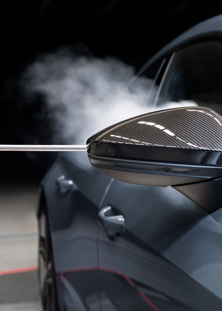 Smoke flows along the body of the Audi RS e-tron GT after passing the exterior mirror.