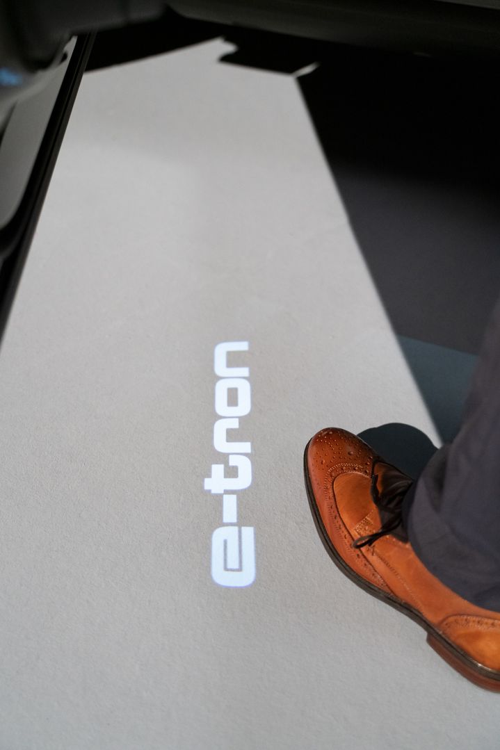 The e-tron logo is projected on the ground below the driver’s door.