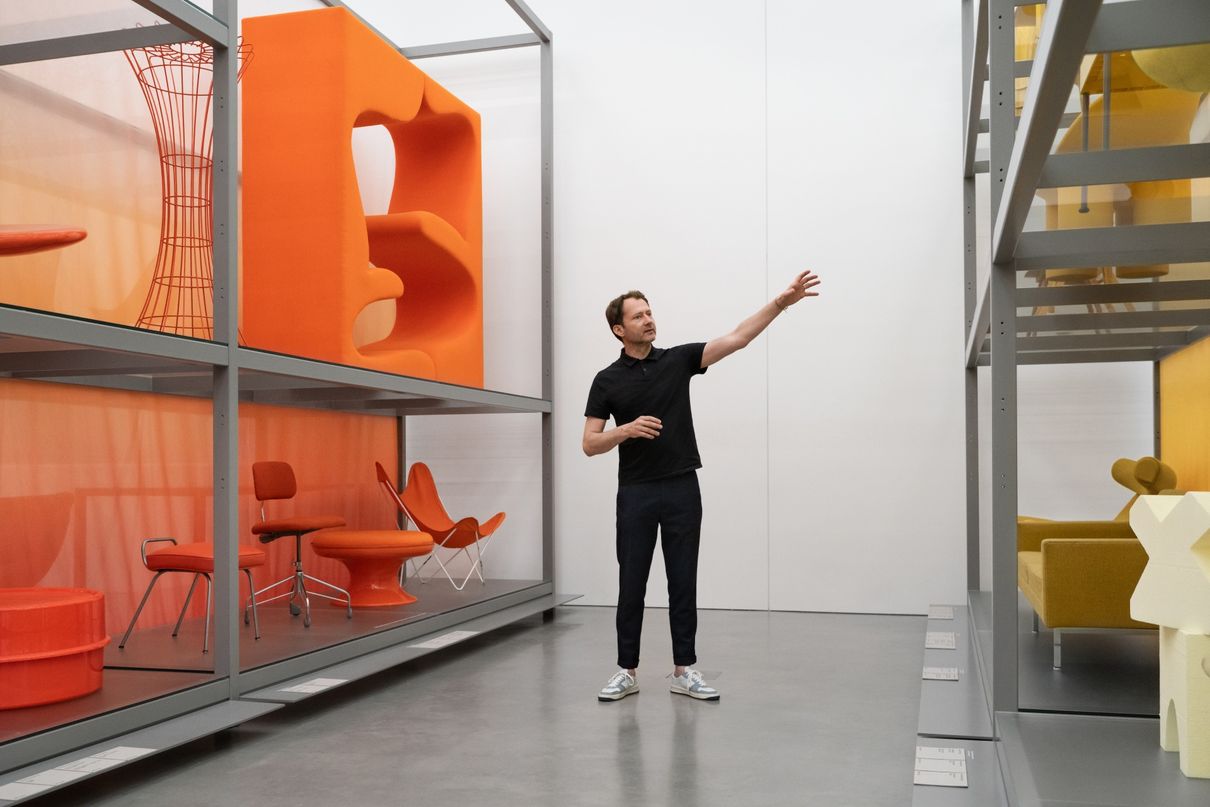 Mateo Kries standing in front of the installation at the Vitra Schaudepot.