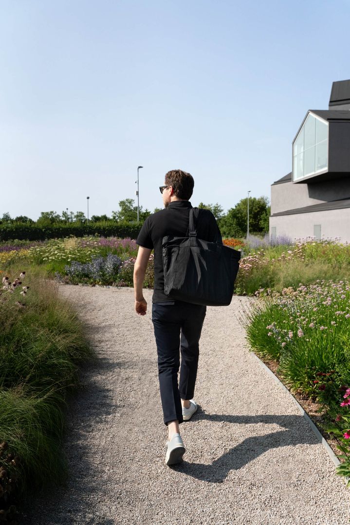 Mateo Kries walking through the garden created by Piet Oudolf on the Vitra Campus.