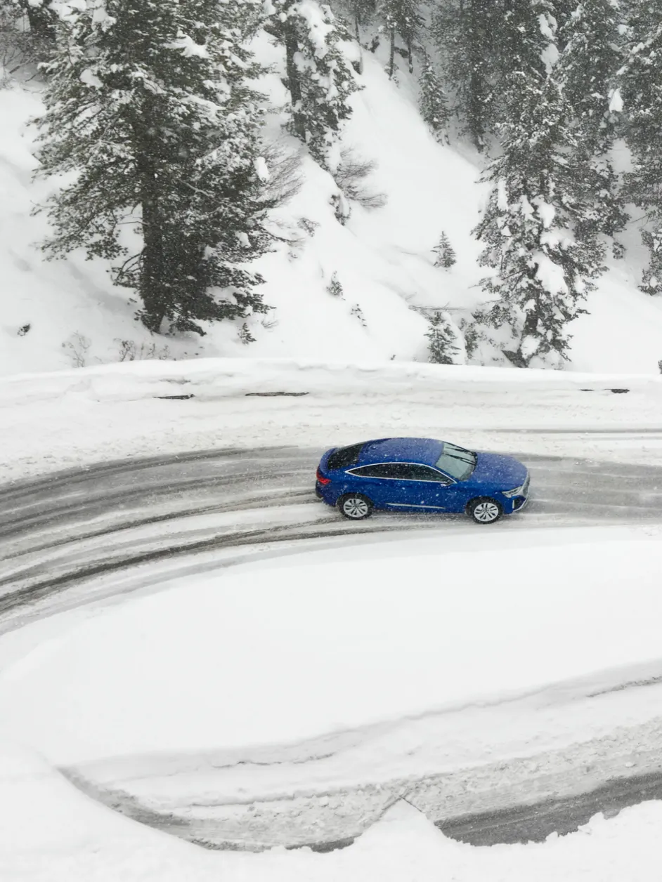 The Audi SQ8 Sportback e-tron driving on snowy roads.